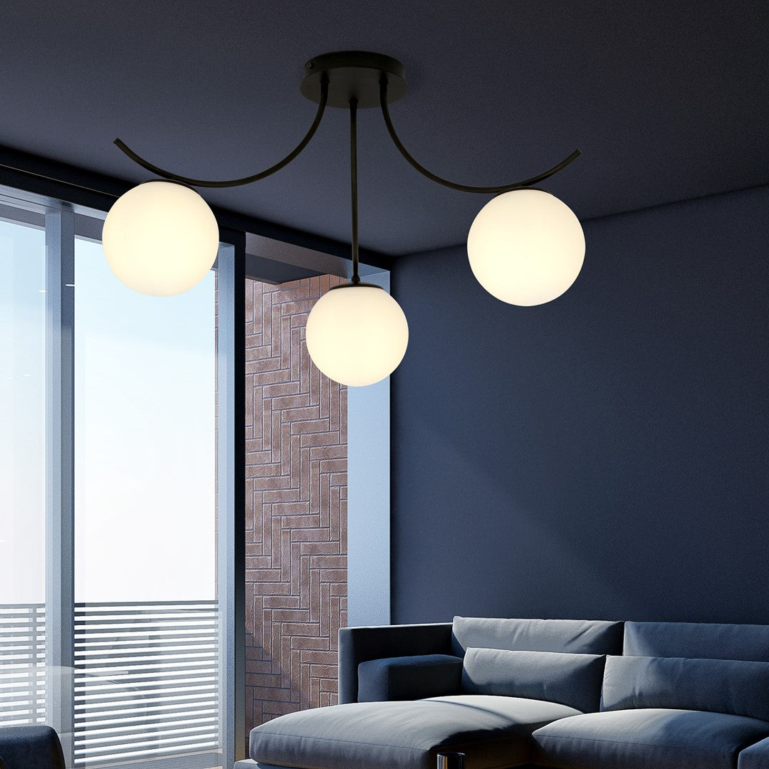 Plafonnier installé au plafond dans un intérieur moderne bleu avec canapé.