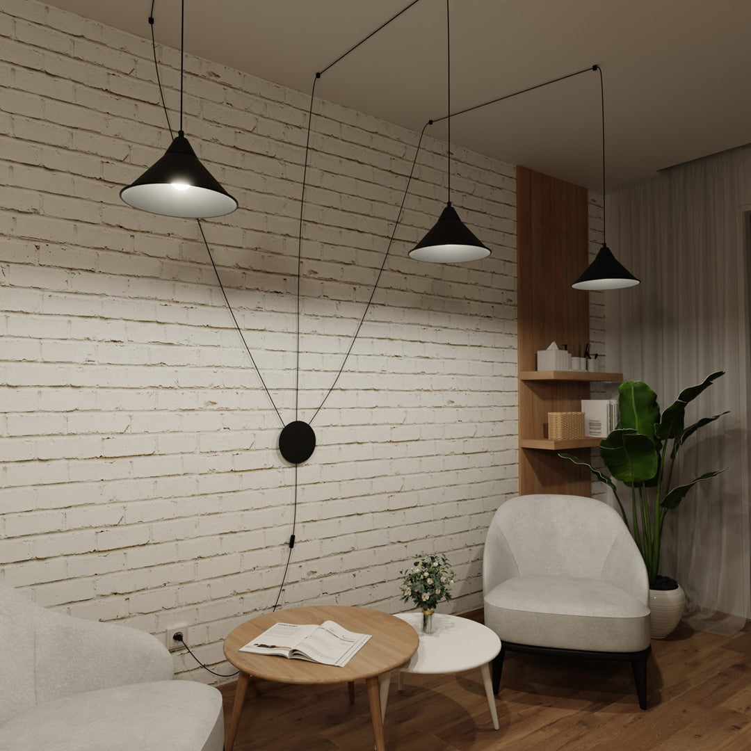 Suspension allumée dans une pièce sombre, mettant en valeur la lumière diffusée.