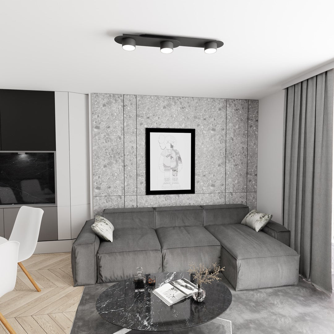 Mise en ambiance dans un salon gris avec canapé d'angle