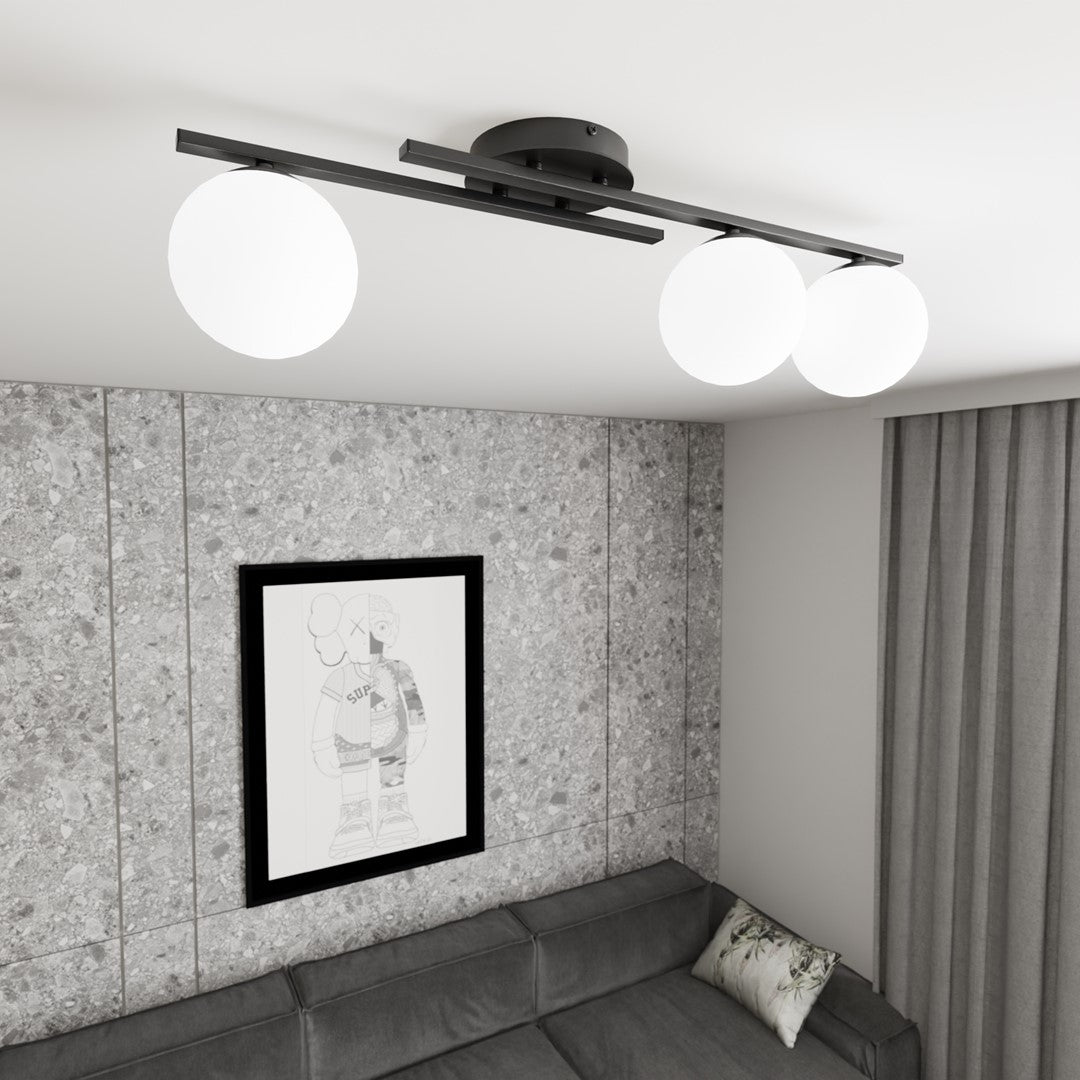 Plafonnier allumé au-dessus d'un canapé d'angle, reflet sur le mur texturé