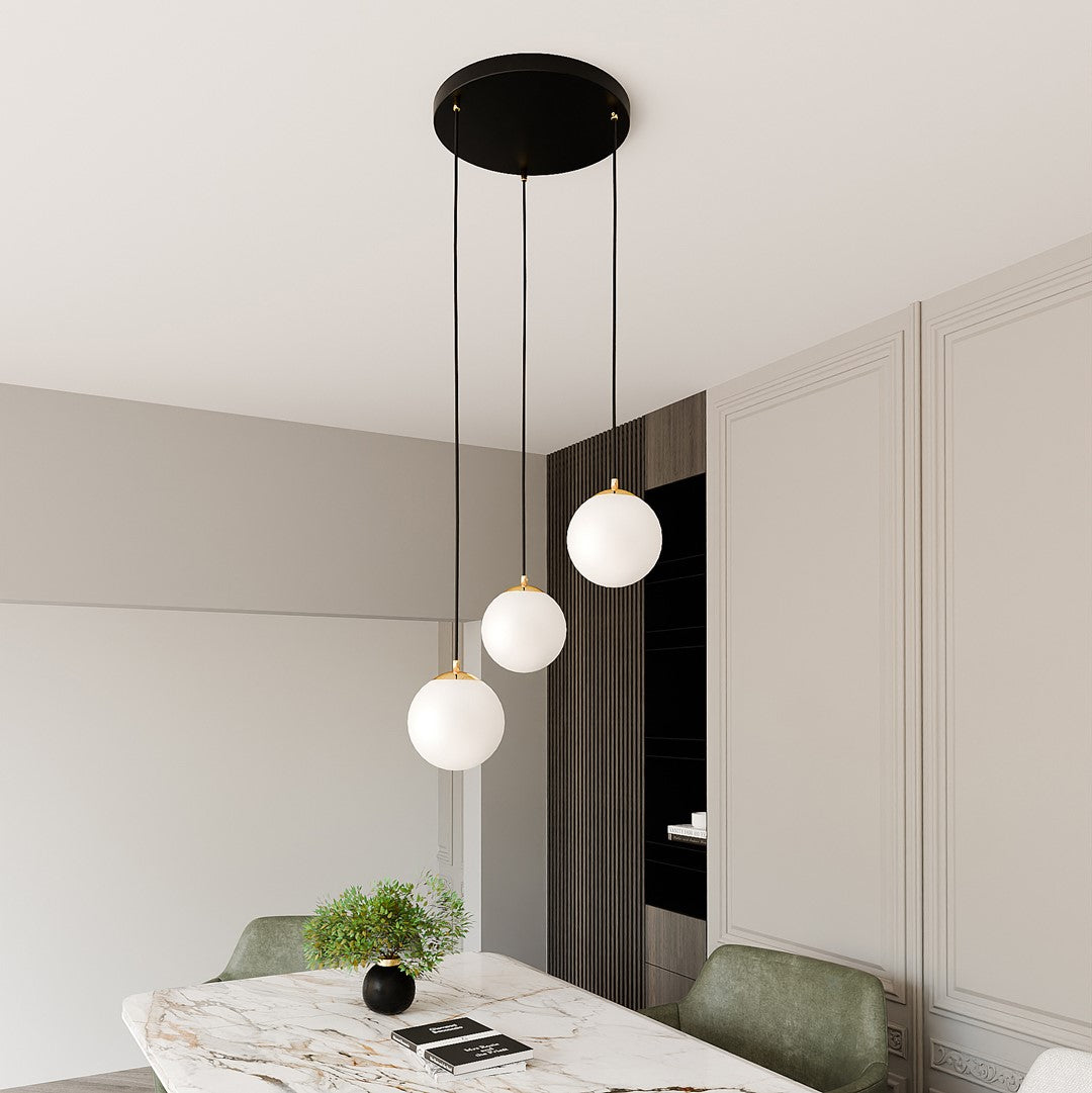 Vue en perspective du luminaire suspendu au-dessus d'une table en marbre
