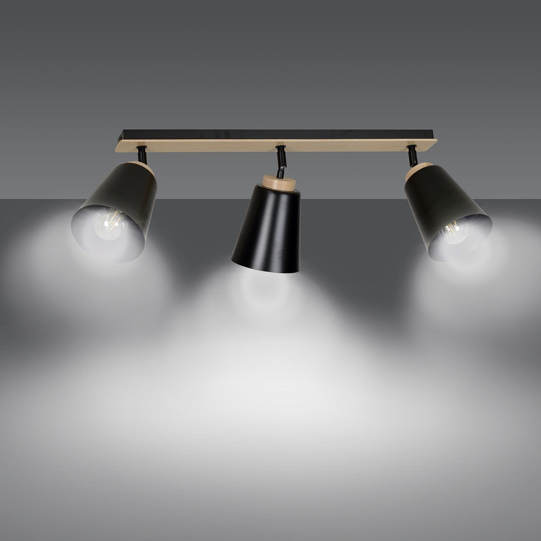Mise en ambiance : trois halos lumineux projetés sur la surface grise
