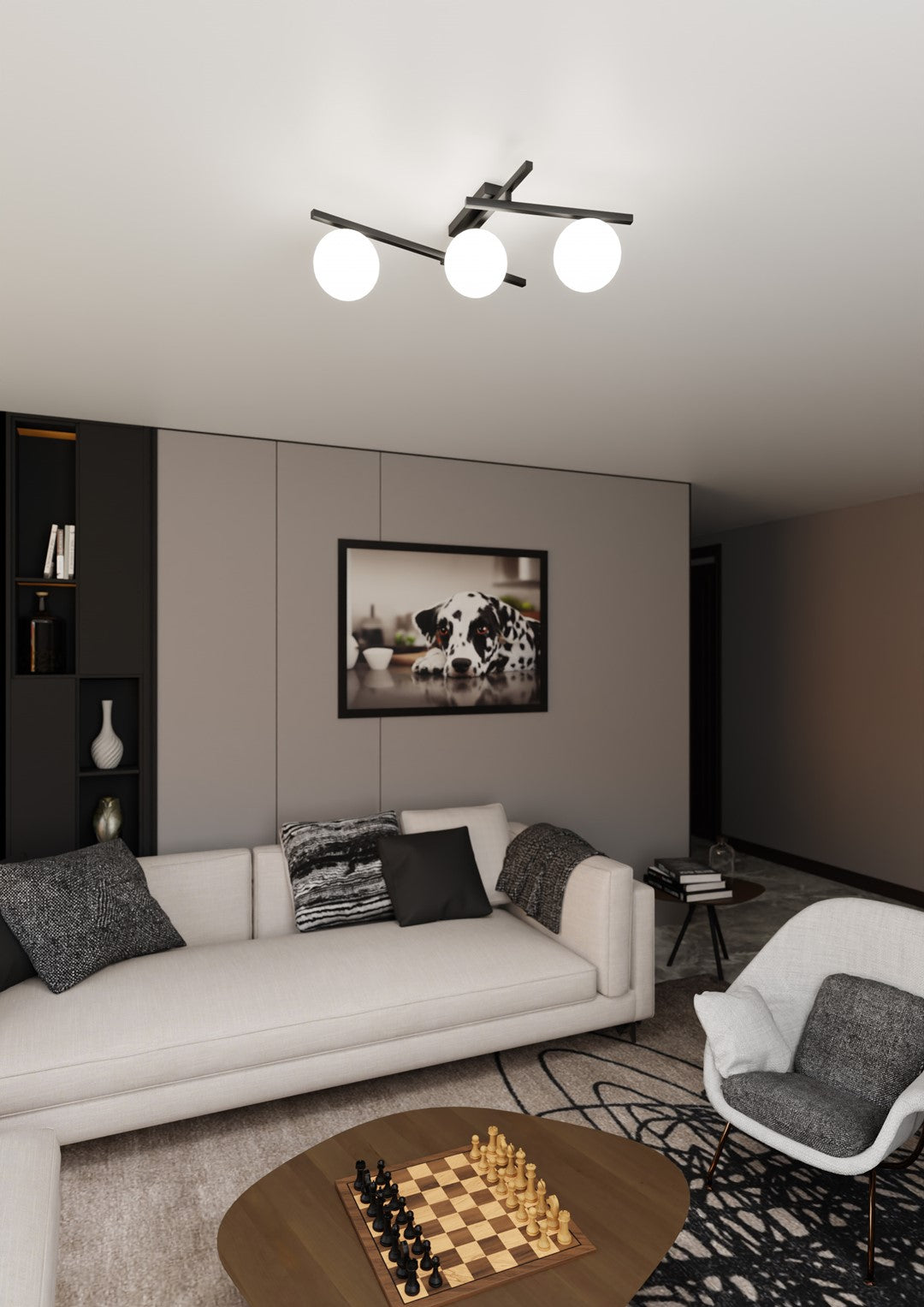 Mise en ambiance dans un salon avec canapé beige, bibliothèque noire et tableau de chien