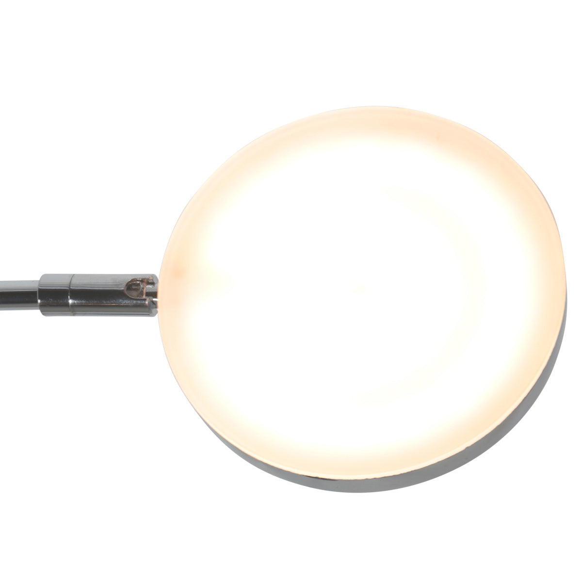 Détail du diffuseur rond allumé offrant une lumière chaude et homogène