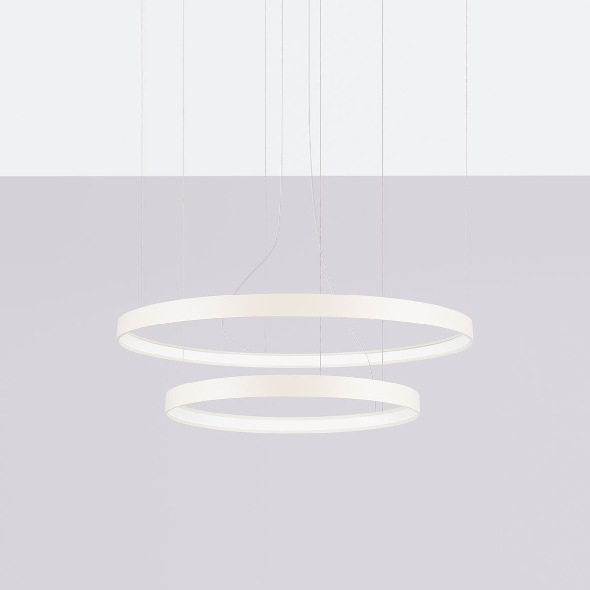 Vue de face du luminaire double anneau blanc avec diffuseur lumineux allumé.