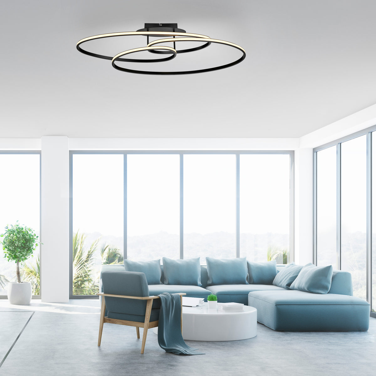 Mise en ambiance du plafonnier fixé au plafond d'un salon contemporain lumineux.