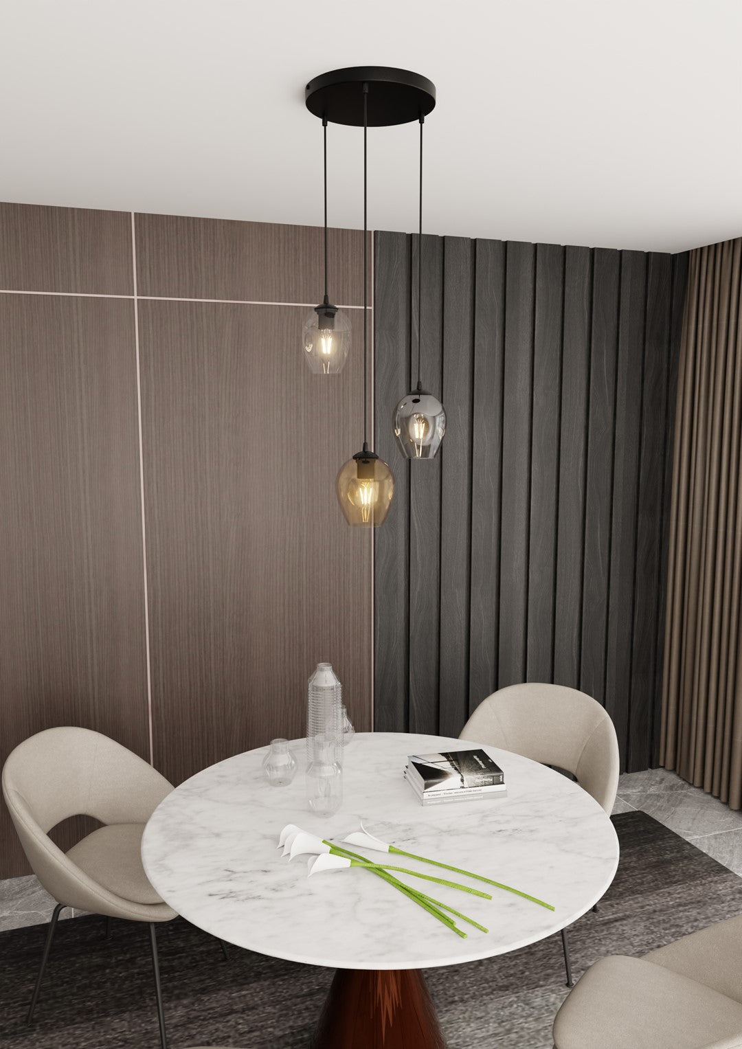 Mise en ambiance salle à manger, suspension noire trois verres au-dessus d'une table ronde en marbre.