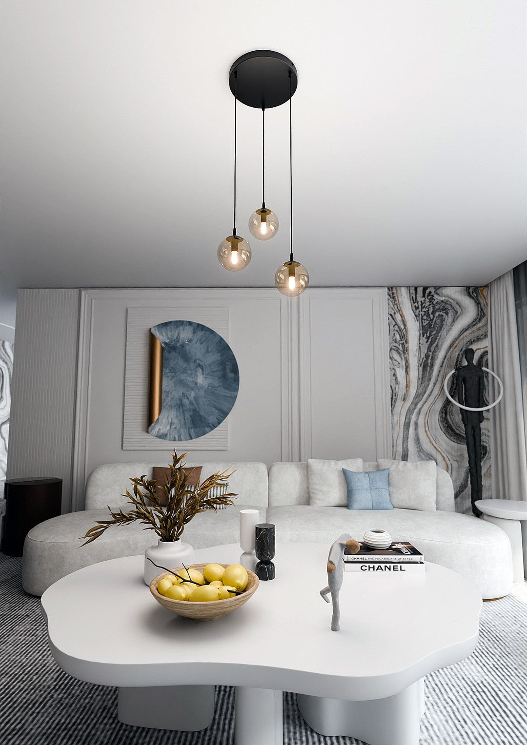 Mise en ambiance d'un salon clair, suspension au-dessus d'une table basse blanche.