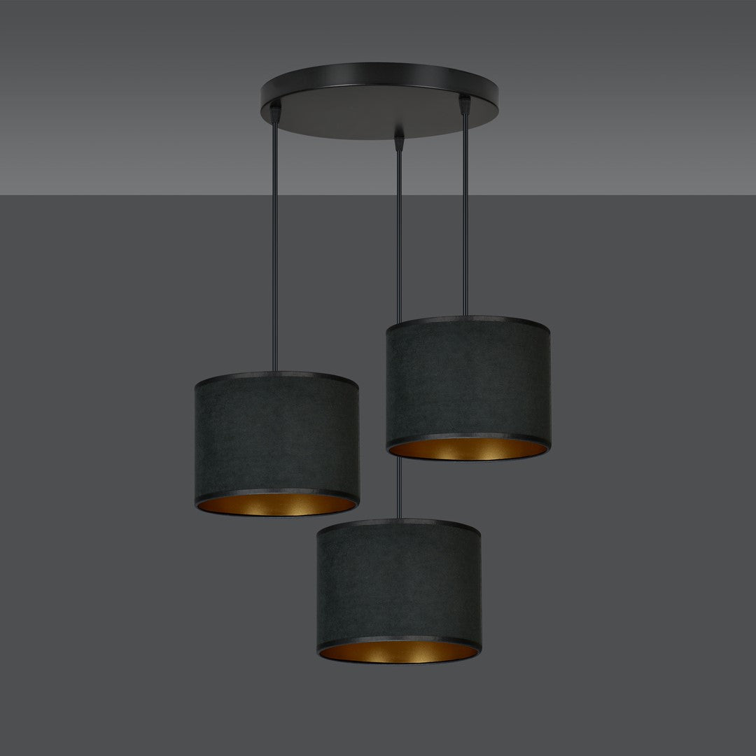 Trois abat-jours cylindriques anthracite à intérieur doré, fond gris dégradé