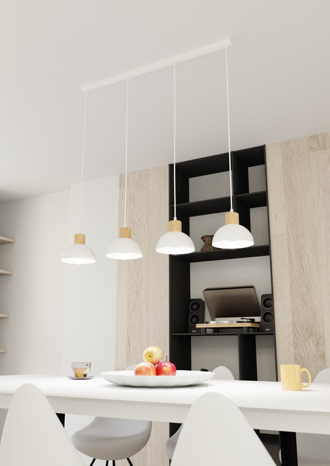Suspension installée au-dessus d'une table blanche dans une salle à manger moderne.
