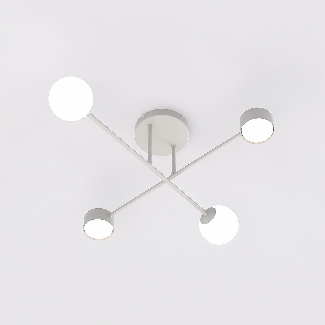 Vue de dessous montrant les quatre diffuseurs et la rosace ronde fixée au plafond