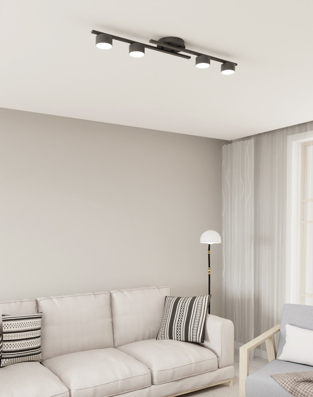 Plafonnier installé au plafond d'un salon clair, canapé beige et lampadaire blanc