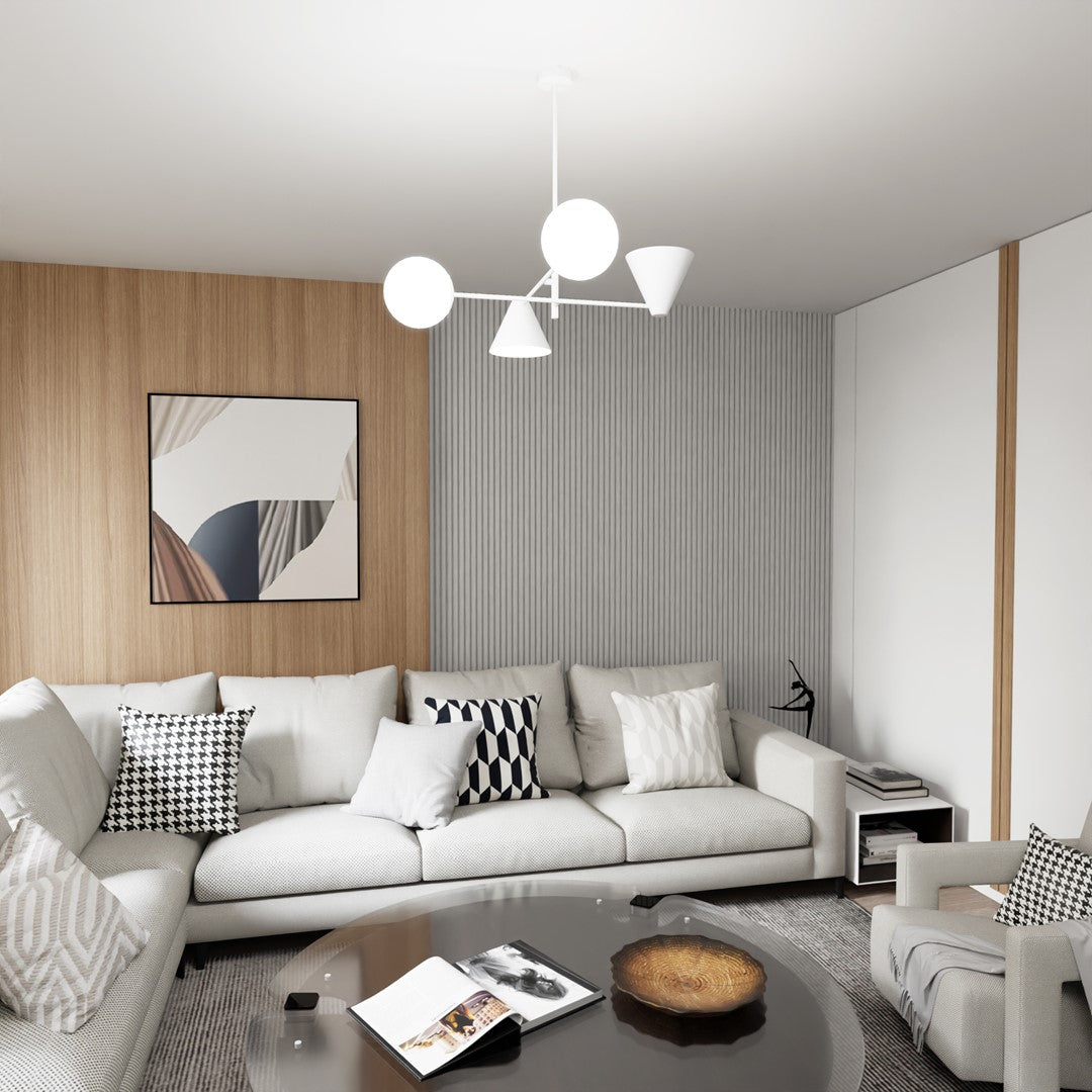 Luminaire suspendu blanc allumé au-dessus d'un canapé dans un salon contemporain.