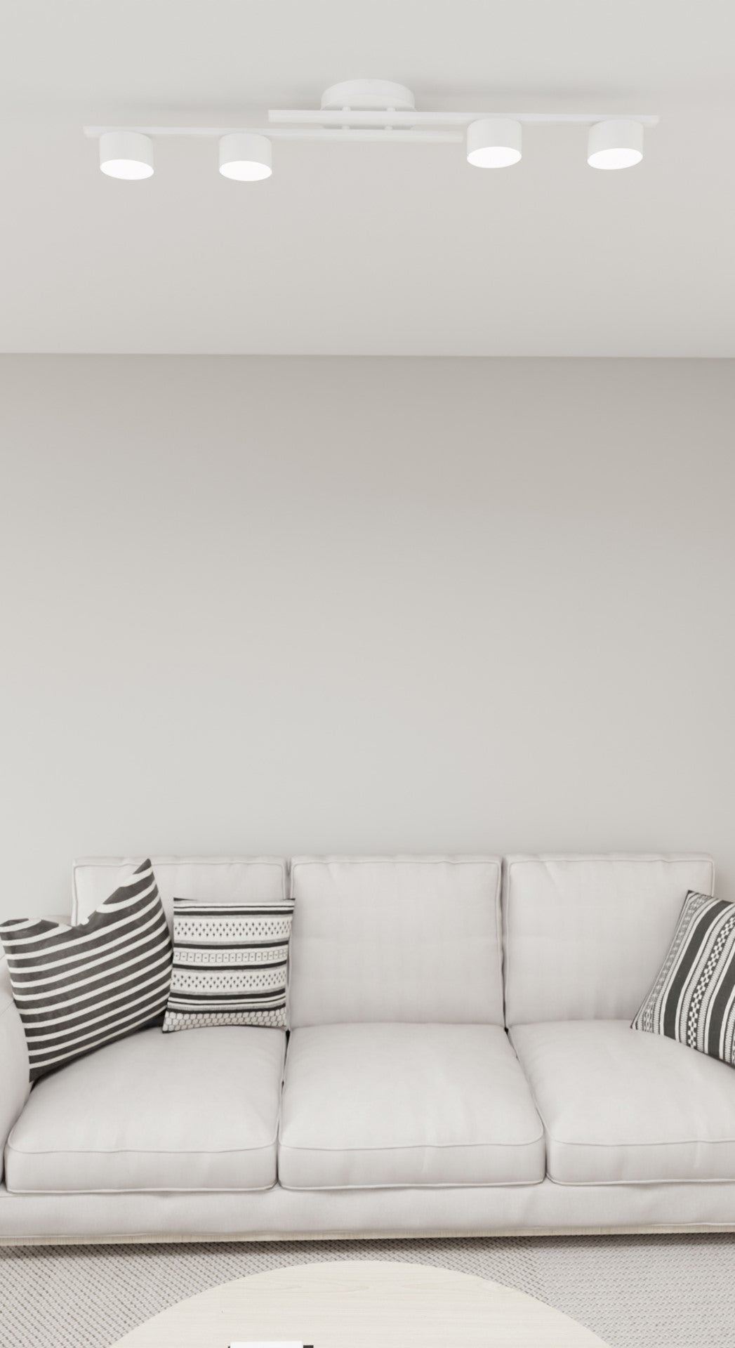 Vue rapprochée depuis le canapé, plafonnier blanc allumé contre le plafond
