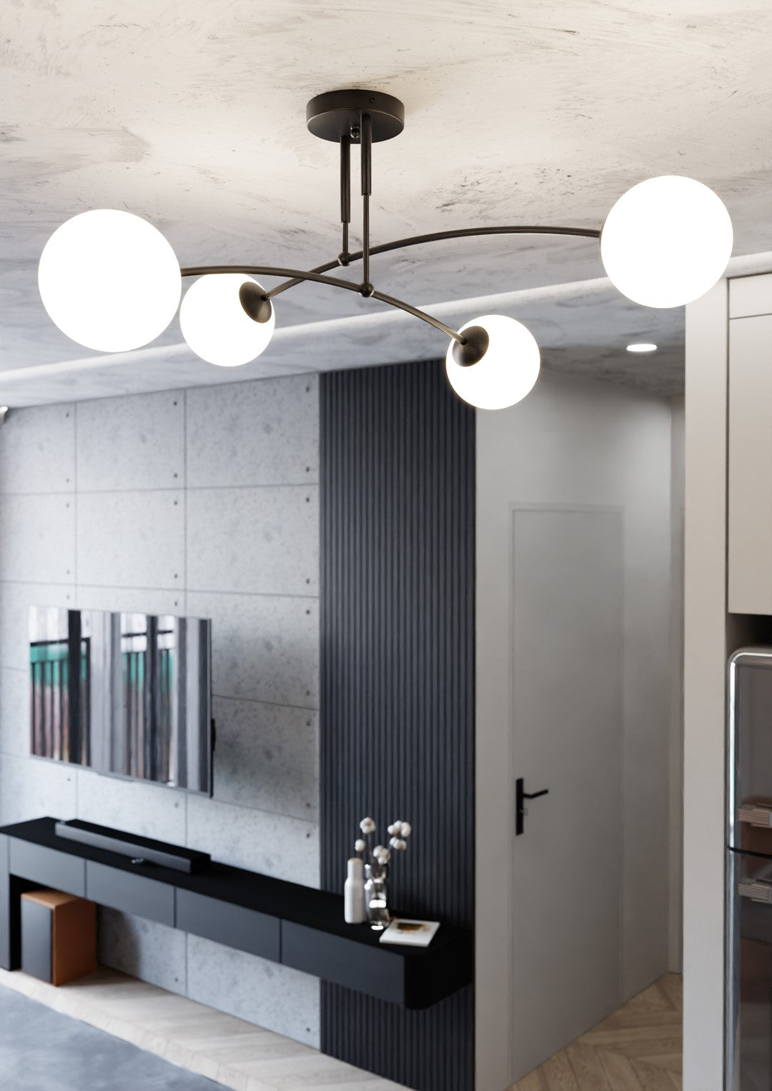 Luminaire allumé dans un salon béton, mur lambris noir et meuble bas