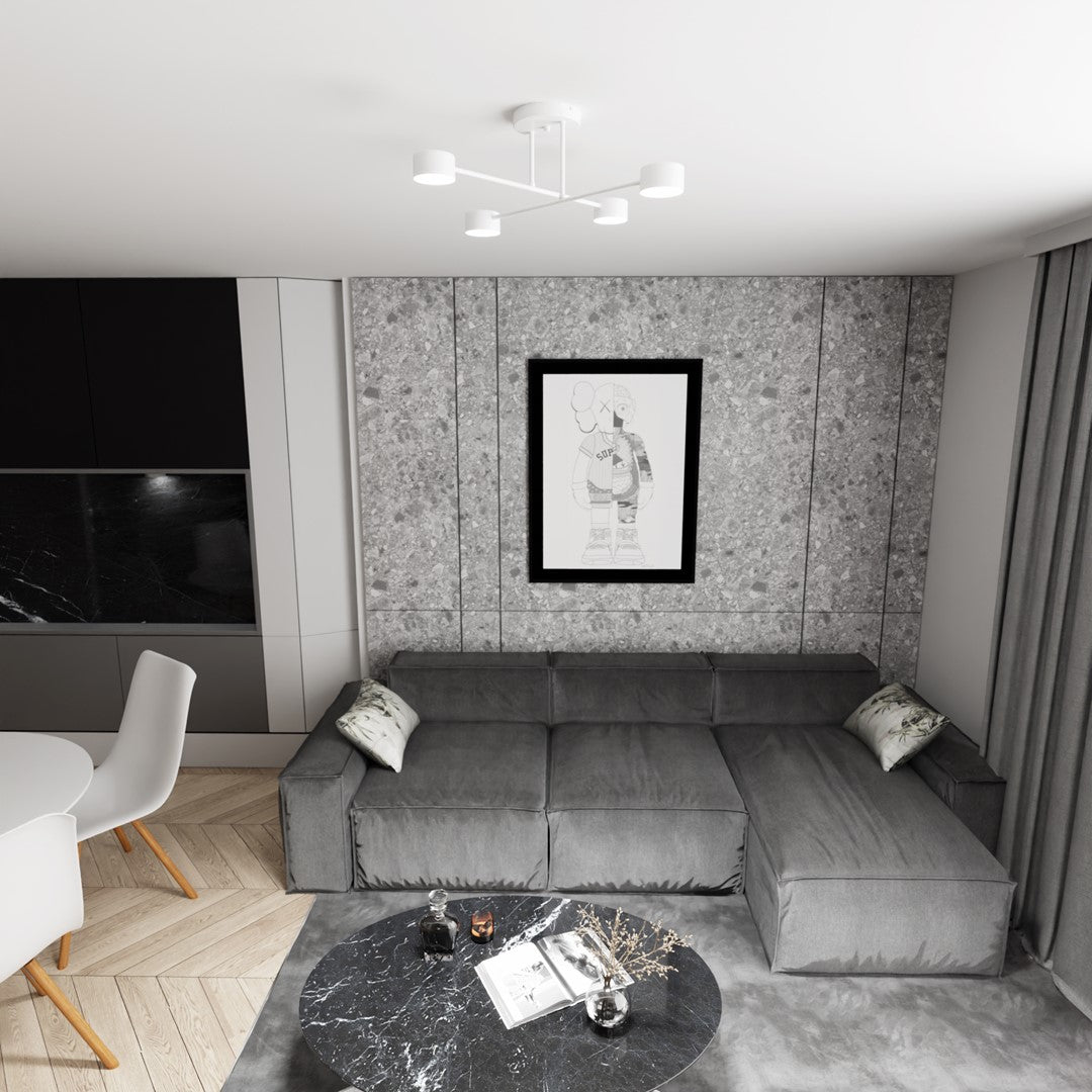 Luminaire allumé au plafond d'un salon gris avec canapé et tableau encadré