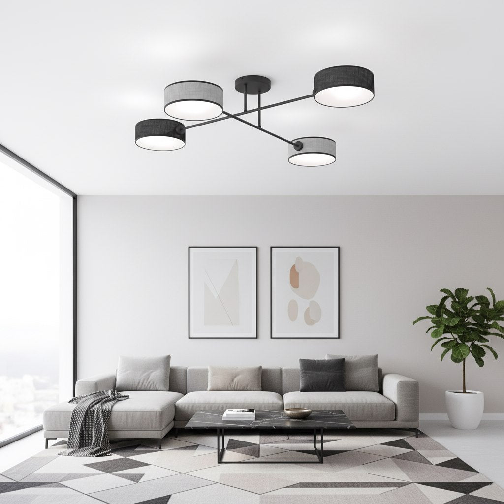 Plafonnier installé dans un salon contemporain, canapé gris et tapis graphique