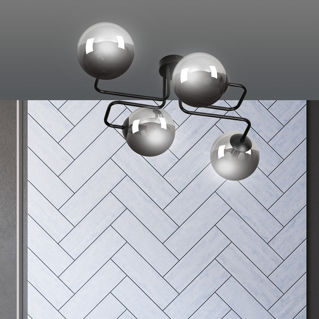 Détail rapproché des bras coudés noirs et des globes en verre graphite