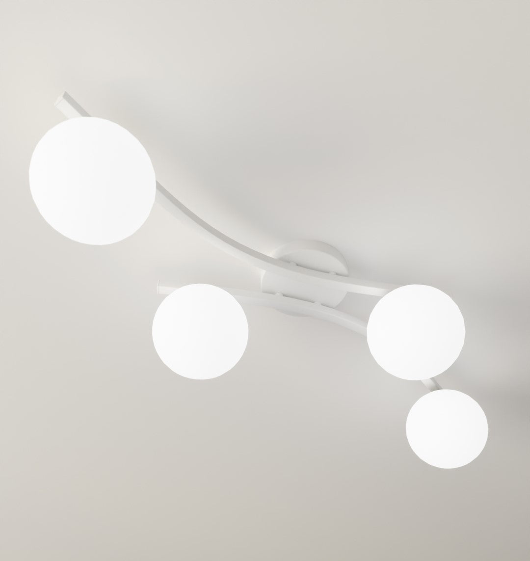 Détail rapproché des bras métalliques blancs et des sphères opaline éclairées