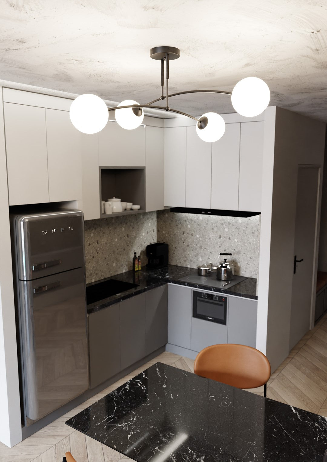 Plafonnier suspendu éclairant une cuisine grise avec table marbre noire