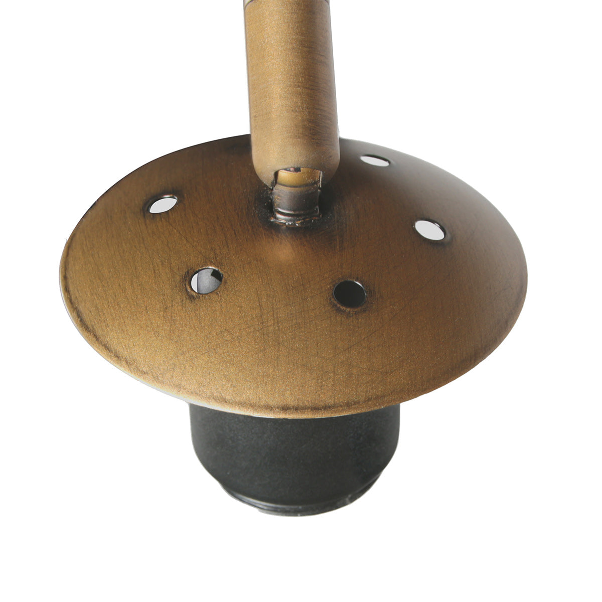 Détail du dessous de la base ronde bronze avec ses trous et le socle noir