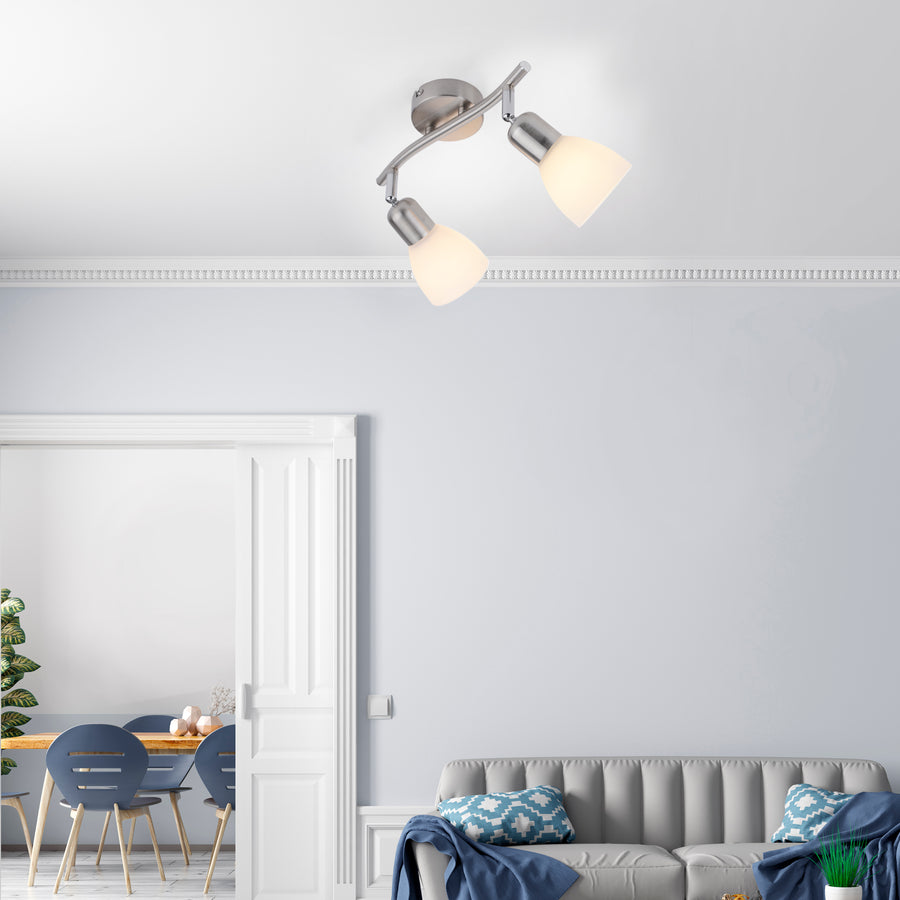Plafonnier installé au plafond dans un salon moderne, canapé et entrée visibles.