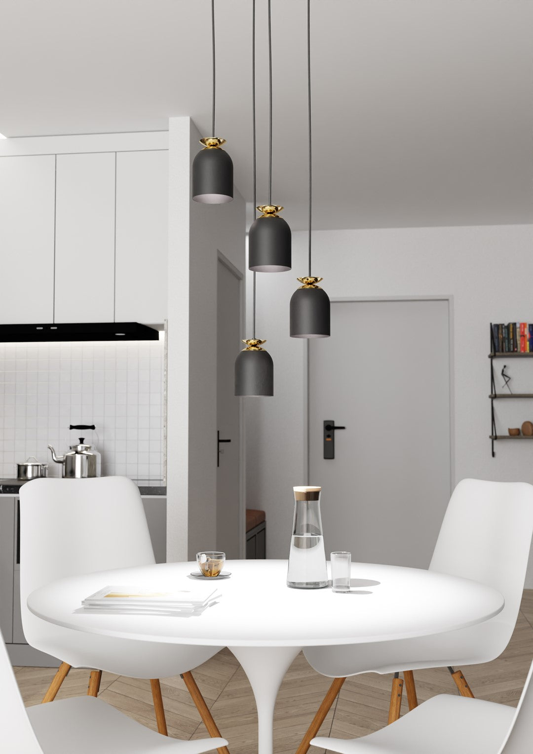 Ambiance cuisine ouverte avec table dressée sous les quatre suspensions décalées