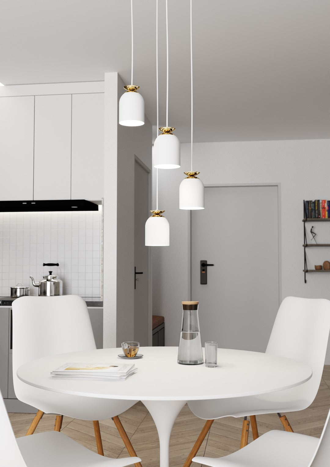 Luminaire allumé dans une cuisine ouverte au décor minimaliste et blanc