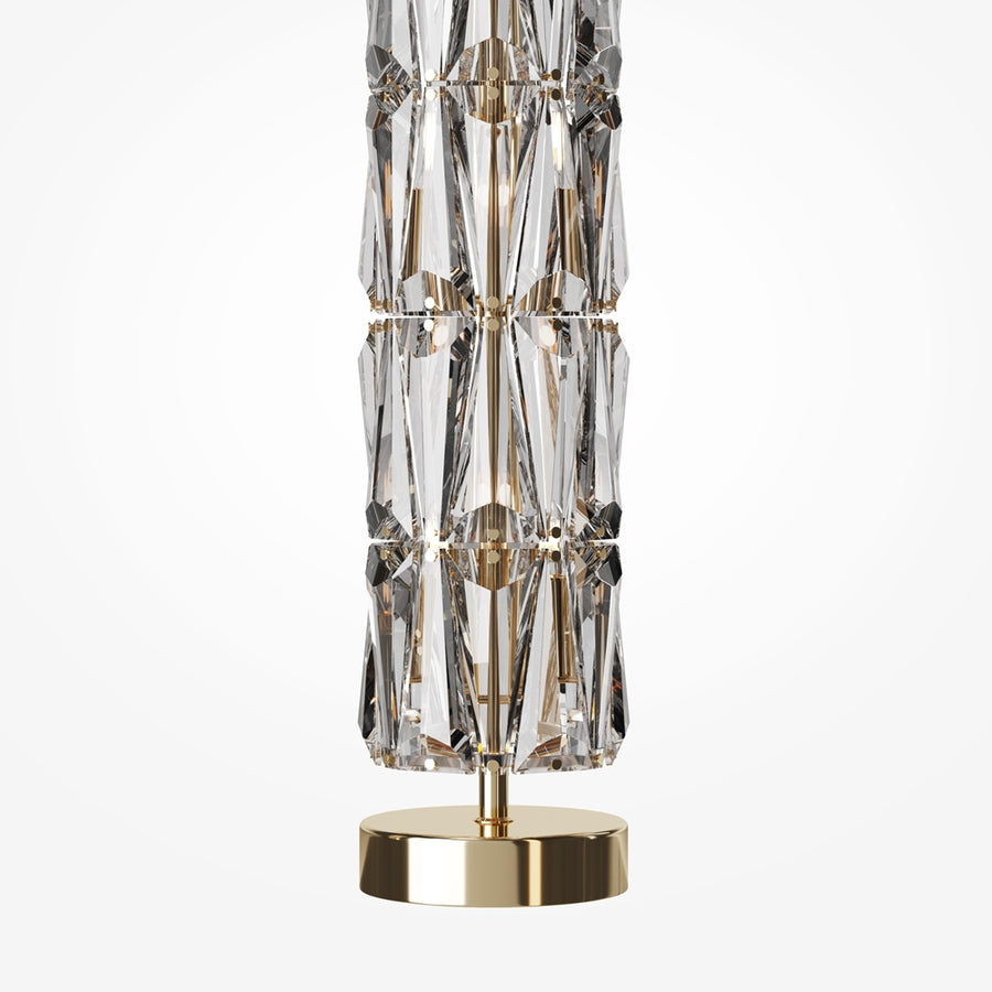 Détail du socle doré et de la base du fût en cristal taillé