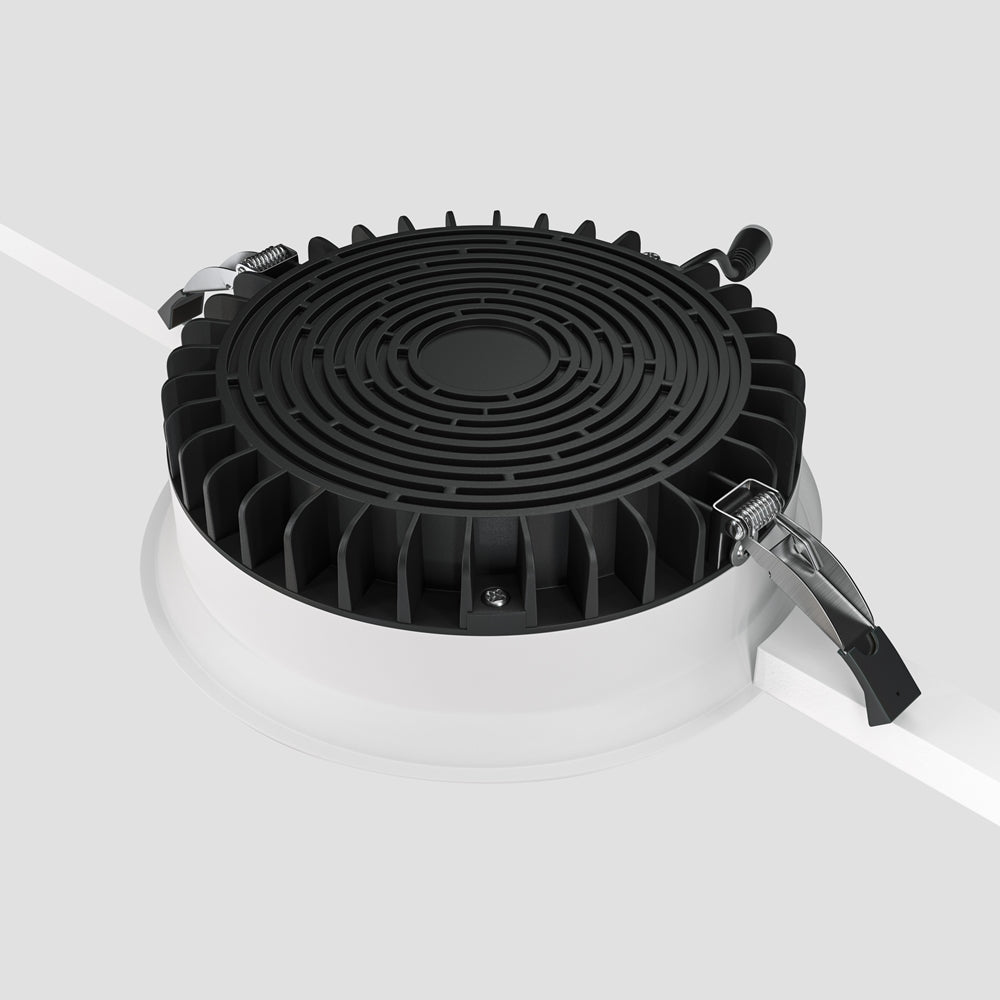 Vue arrière détaillée du radiateur noir à ailettes et ressorts métalliques.