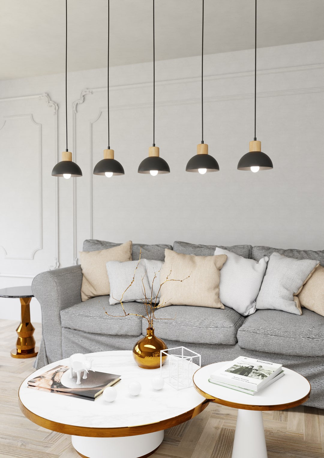 Ambiance salon, suspensions allumées au-dessus d'une table basse et d'un canapé gris