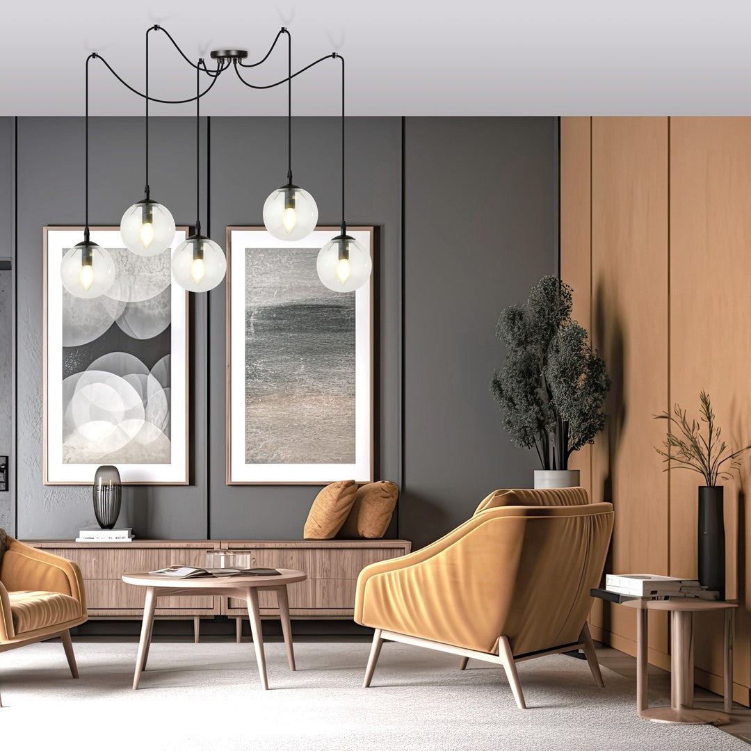 Mise en ambiance du luminaire suspendu au-dessus d'un salon moderne avec fauteuils