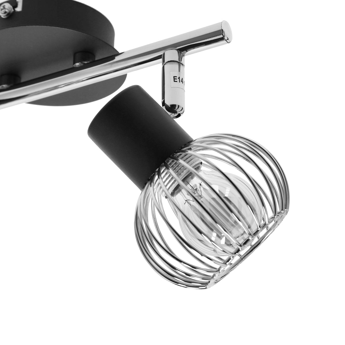 Gros plan sur un spot orientable, douille E14 visible et cage métallique.