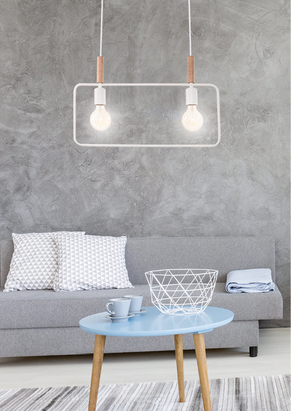 Mise en ambiance du modèle blanc au-dessus d'un canapé gris et d'une table basse bleue.