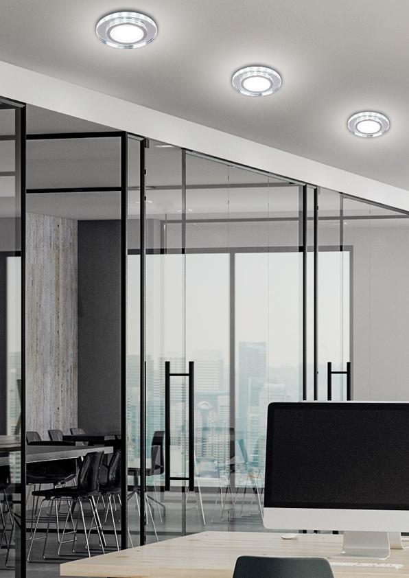 Ambiance de travail : plafond blanc équipé de trois luminaires ronds encastrés en fonctionnement