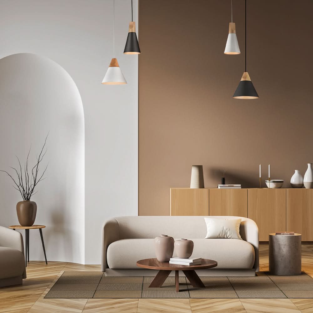 Mise en ambiance : plusieurs suspensions grises et blanches au-dessus d'un salon
