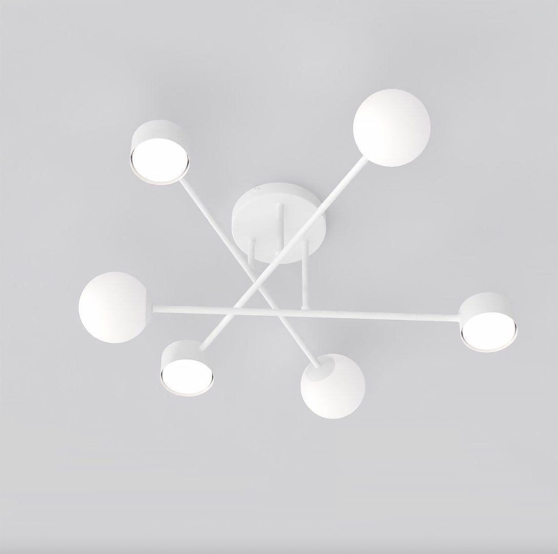Vue de dessous du luminaire montrant les six diffuseurs allumés disposés en croix