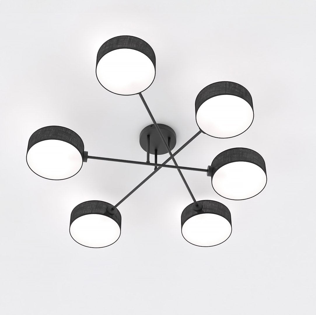 Vue en plongée du luminaire, six abat-jour cylindriques noirs et éclairés