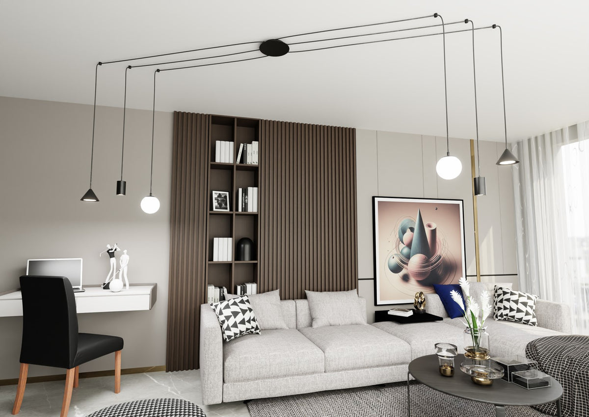 Suspension allumée au-dessus d'un salon moderne avec canapé gris et bibliothèque.