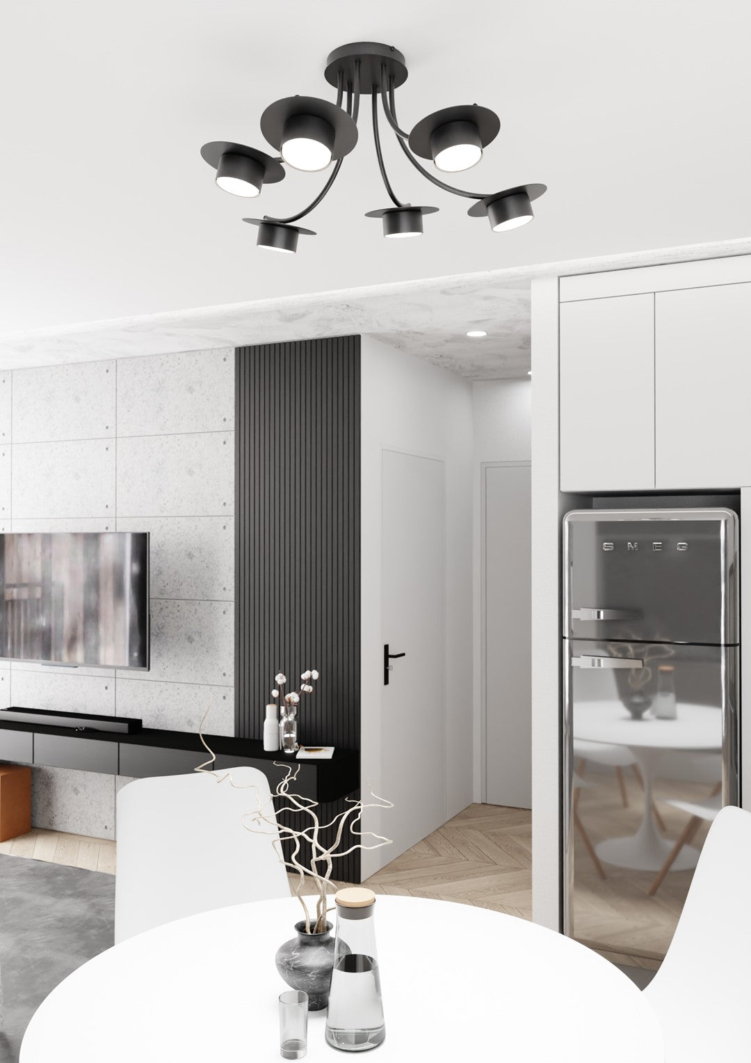 Suspension noire installée au-dessus d'une table dans une cuisine moderne