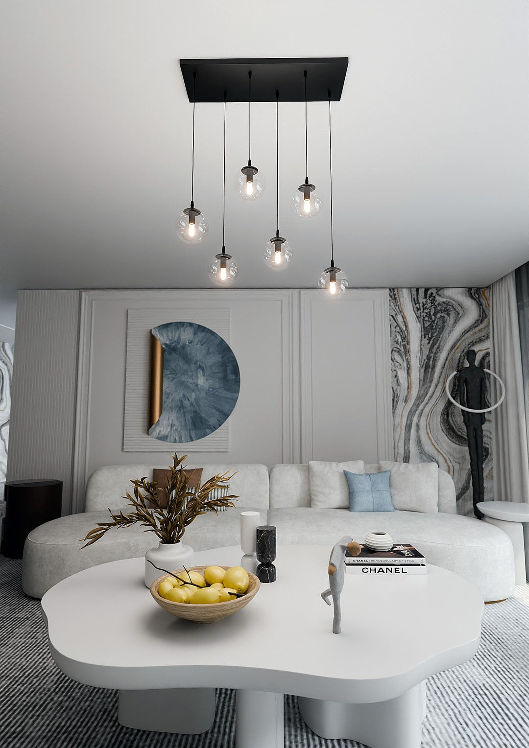 Mise en ambiance salon, suspension à six globes au-dessus d'une table basse blanche