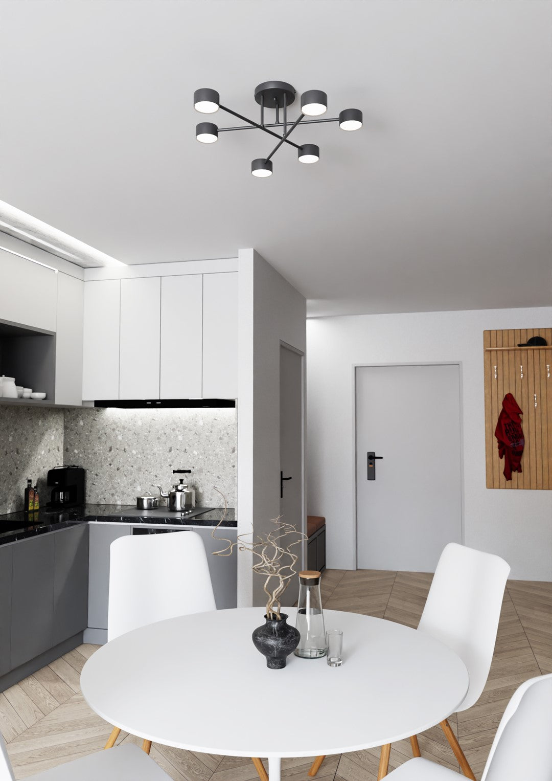 Le luminaire fixé au plafond éclaire une salle à manger et cuisine