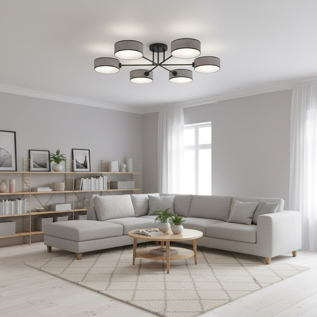 Mise en ambiance dans un salon gris clair avec canapé d'angle