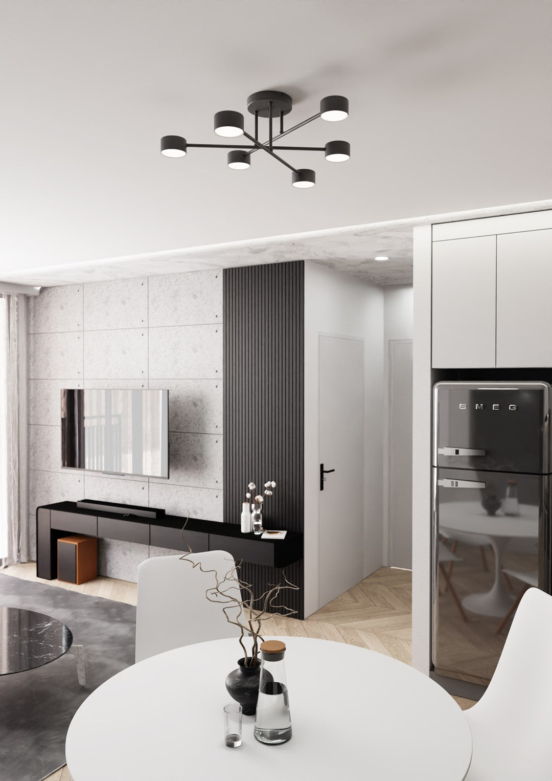 Ambiance salon contemporain avec le plafonnier noir et un réfrigérateur rétro