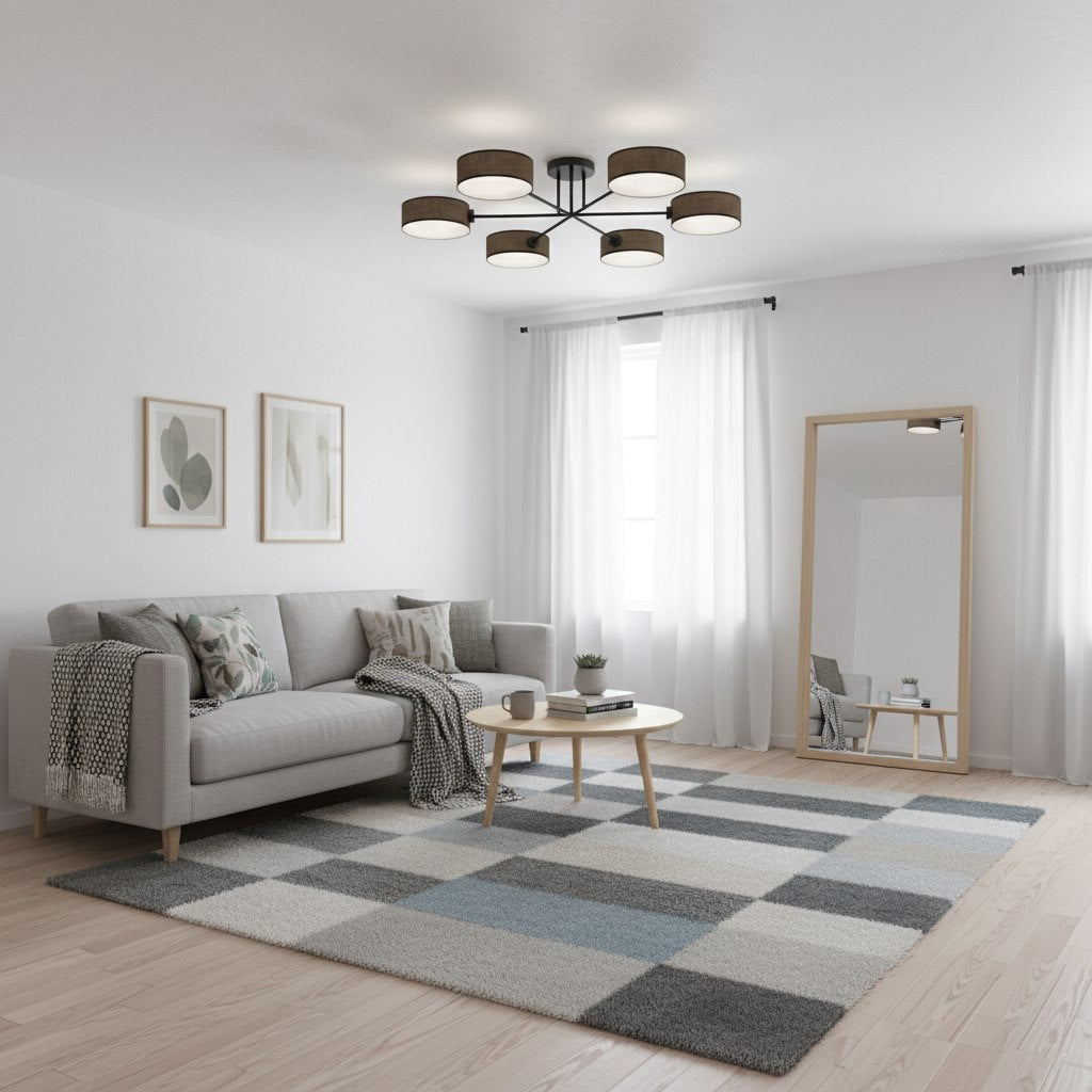 Mise en scène du plafonnier allumé dans un salon gris et blanc.