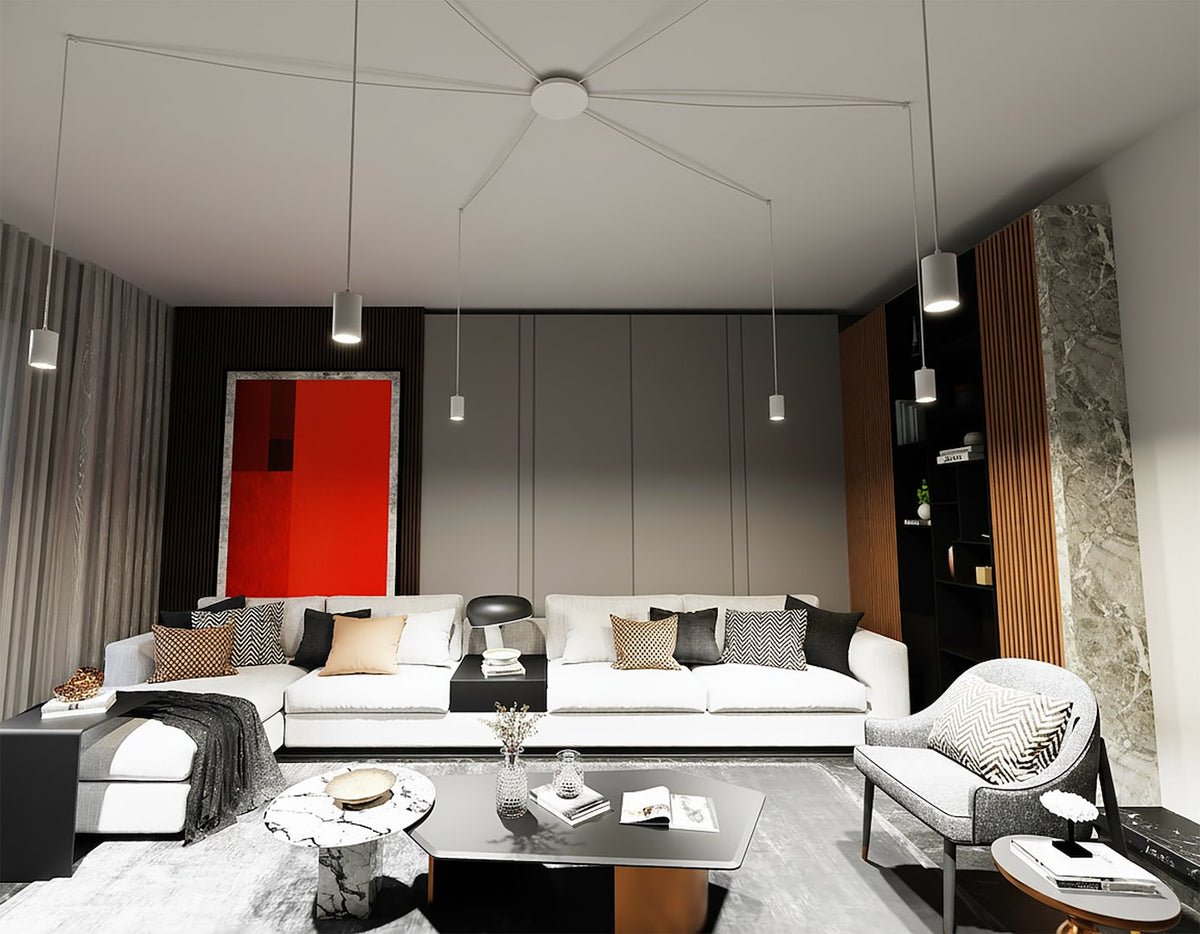 Le luminaire éclaire le séjour design aux canapés blancs et coussins graphiques