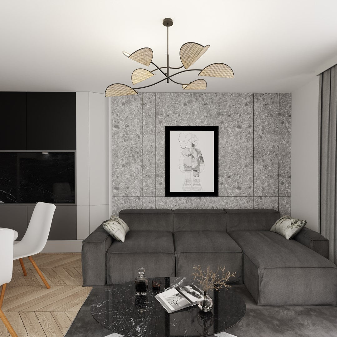 Suspension installée dans un salon, au-dessus d'un canapé gris et d'une table basse en marbre noir.