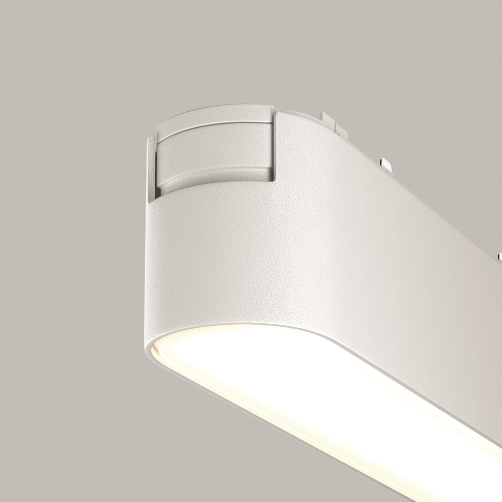 Détail rapproché de l'extrémité arrondie et de la surface grainée du luminaire.