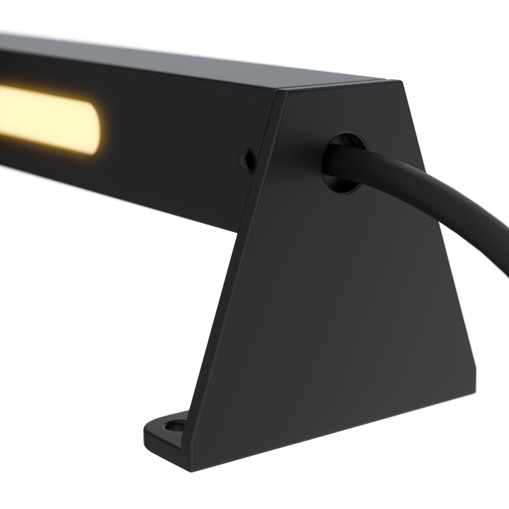 Gros plan sur le support latéral noir et le passe-câble du luminaire