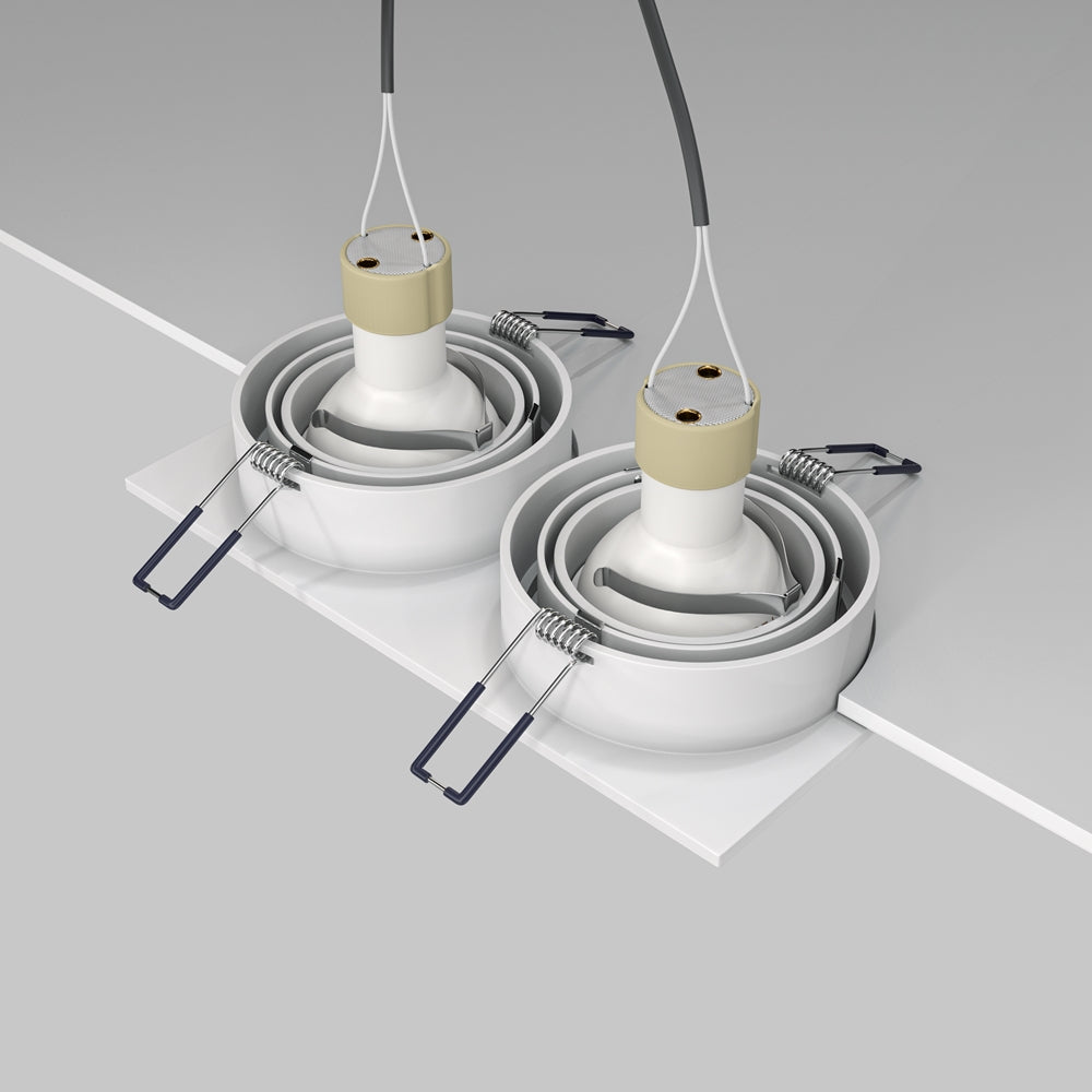 Détail du mécanisme d'encastrement avec ressorts de fixation et douilles de connexion